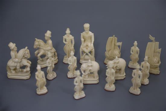 A rare 18th century white and brown walrus ivory Russian chess set, featuring Russians against Persians, in mahogany box,